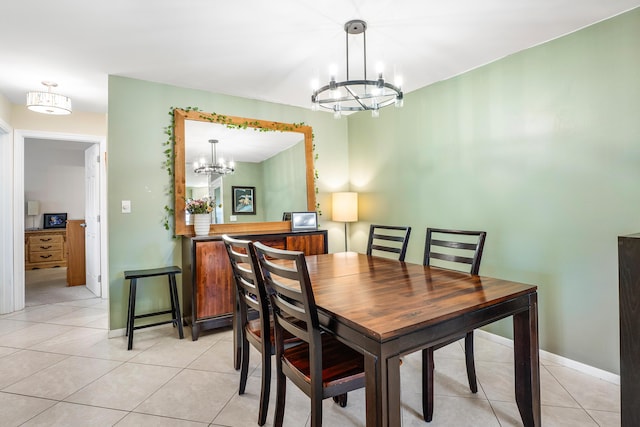 tiled dining space featuring an inviting chandelier