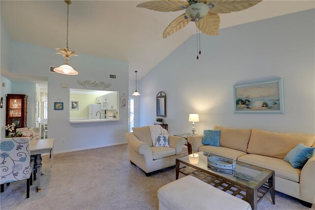 living room with carpet, ceiling fan, and high vaulted ceiling