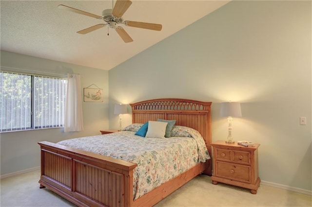 bedroom with light carpet, vaulted ceiling, and ceiling fan