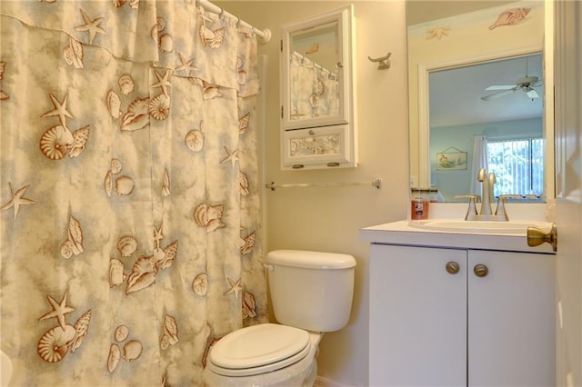 bathroom featuring ceiling fan, vanity, and toilet