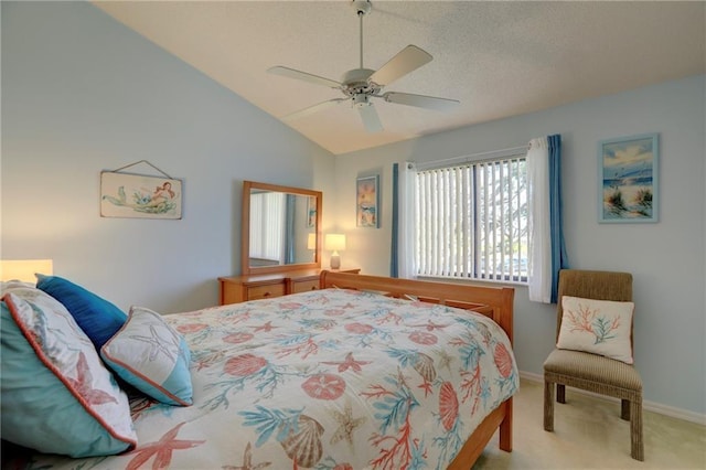 carpeted bedroom featuring ceiling fan and lofted ceiling