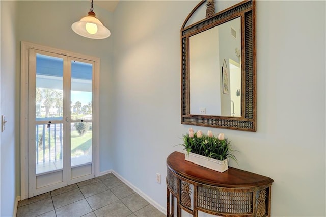 doorway featuring light tile patterned floors