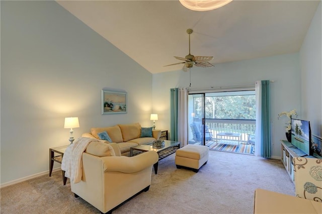 carpeted living room with ceiling fan and high vaulted ceiling