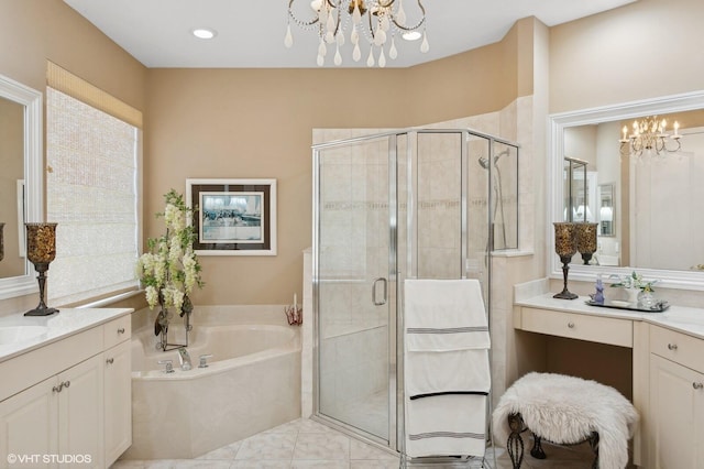 bathroom featuring vanity, separate shower and tub, and an inviting chandelier