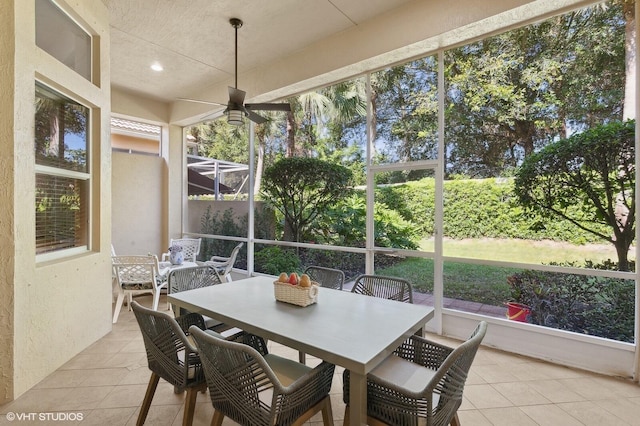 sunroom / solarium featuring ceiling fan