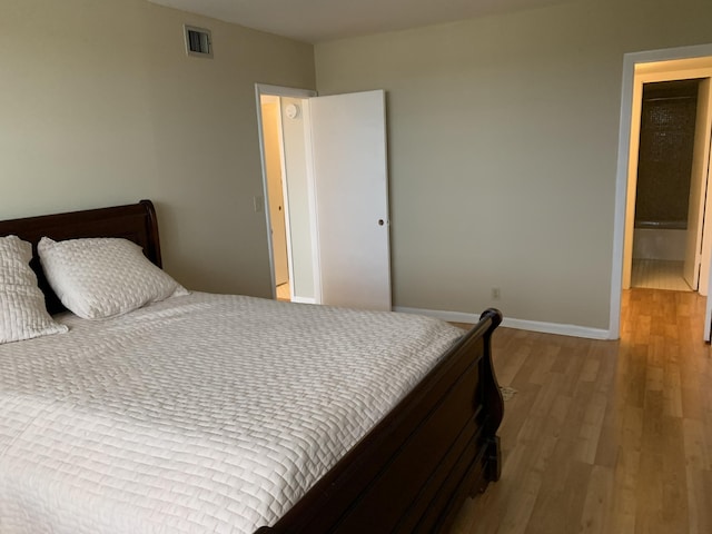 bedroom featuring light wood-type flooring