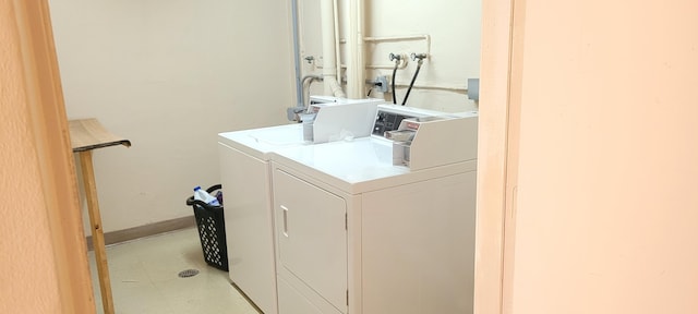 washroom with independent washer and dryer