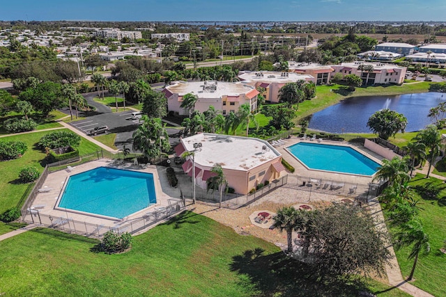 view of swimming pool featuring a water view