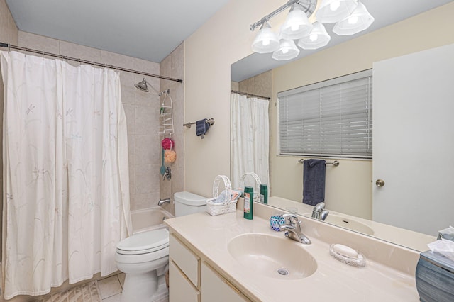 full bathroom featuring tile patterned floors, vanity, toilet, and shower / tub combo