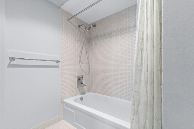 bathroom featuring tile patterned floors and shower / tub combo