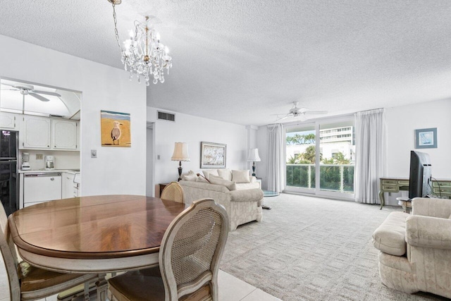 dining space with a notable chandelier and a textured ceiling