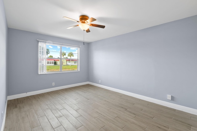 empty room featuring light wood-type flooring and ceiling fan