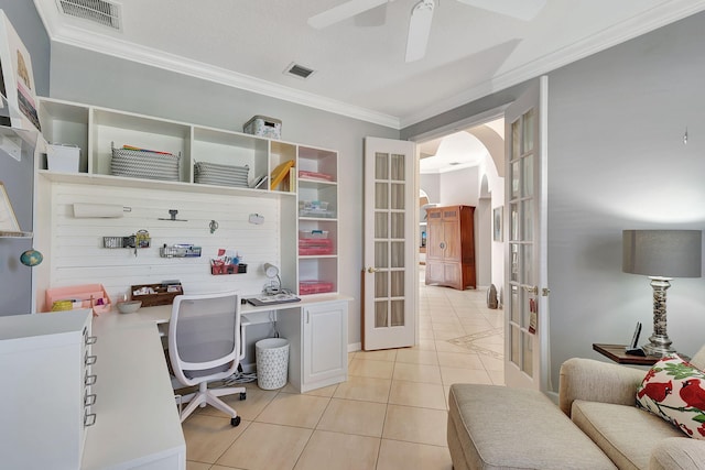 tiled home office featuring ornamental molding and french doors