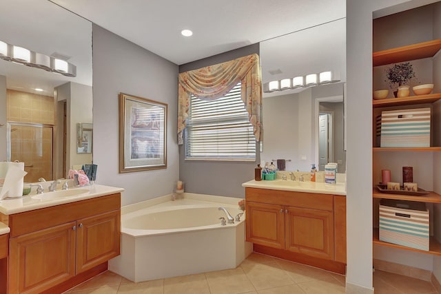 bathroom featuring tile patterned floors, vanity, and independent shower and bath