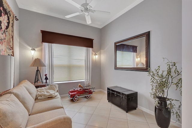 tiled living room featuring plenty of natural light, ceiling fan, and crown molding