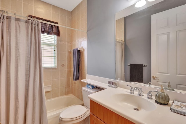 full bathroom with shower / bath combo with shower curtain, vanity, and toilet