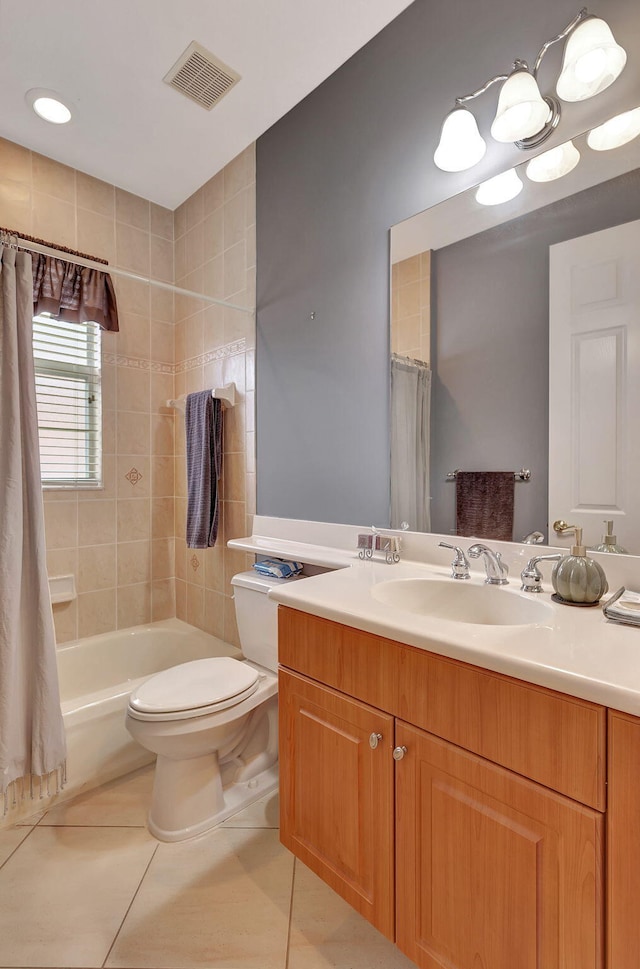 full bathroom featuring toilet, vanity, tile patterned floors, and shower / tub combo with curtain