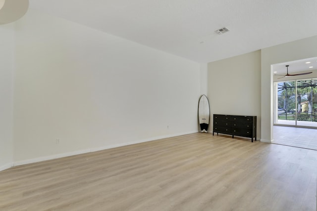 unfurnished living room with ceiling fan and light hardwood / wood-style flooring