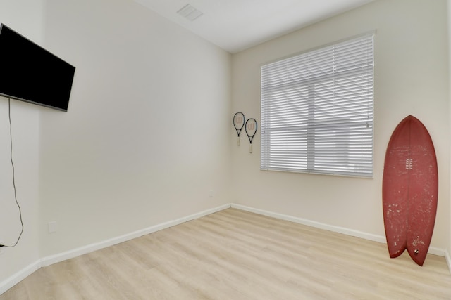 unfurnished room featuring light wood-type flooring