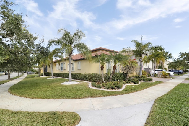 view of side of property with a lawn