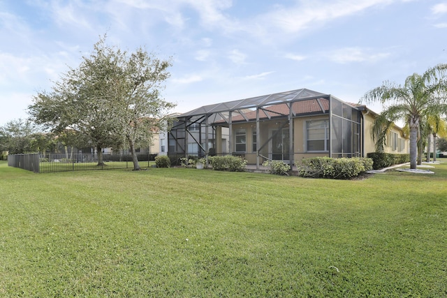 view of yard featuring glass enclosure