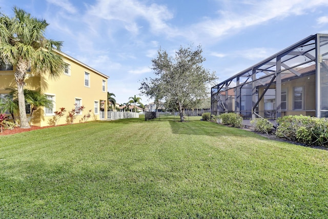 view of yard with a lanai