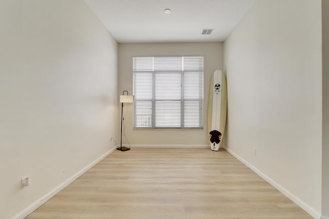 unfurnished room featuring light hardwood / wood-style floors