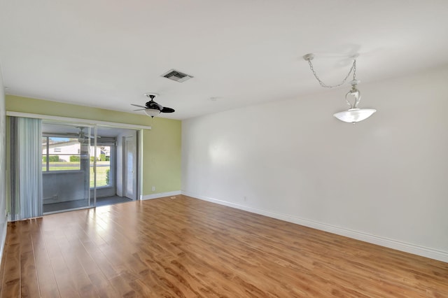 spare room featuring ceiling fan and light hardwood / wood-style flooring