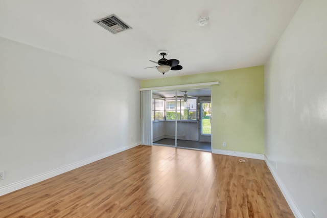 unfurnished room featuring light wood-type flooring and ceiling fan