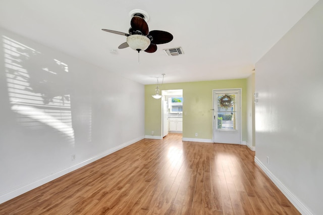 interior space with ceiling fan and light hardwood / wood-style flooring