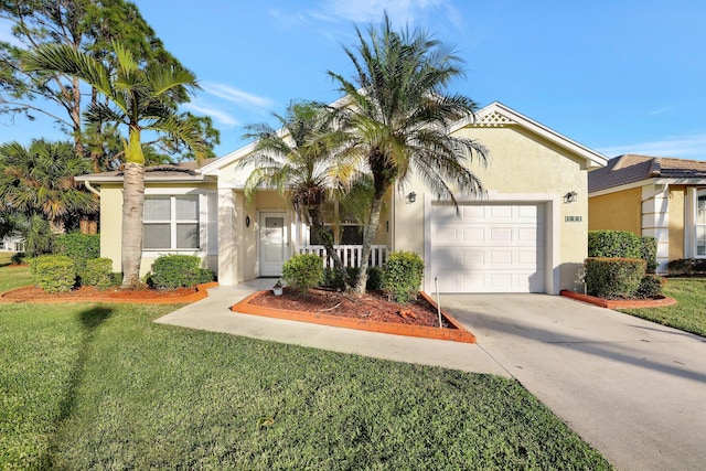 single story home with a garage, driveway, a front lawn, and stucco siding