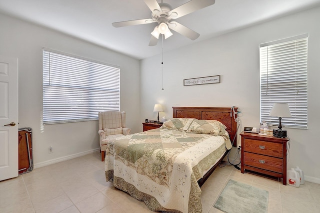 tiled bedroom featuring ceiling fan