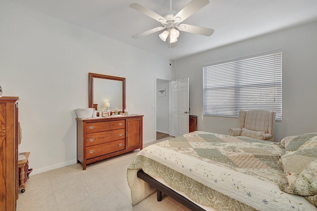 tiled bedroom with ceiling fan