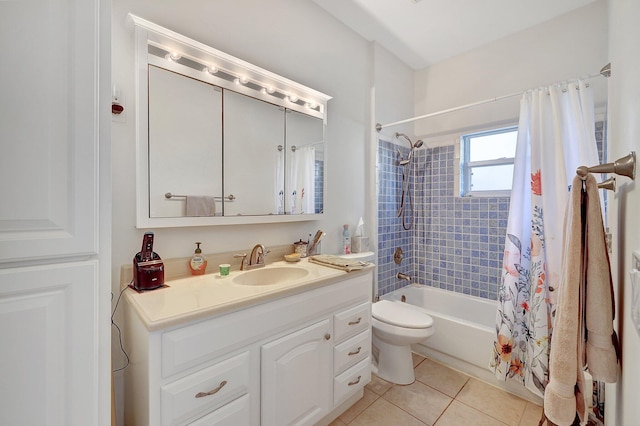 full bathroom featuring tile patterned floors, shower / bath combo with shower curtain, vanity, and toilet