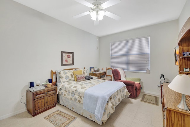 tiled bedroom featuring ceiling fan