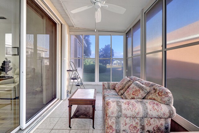 sunroom featuring ceiling fan and a wealth of natural light