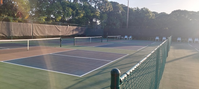 view of tennis court featuring basketball court