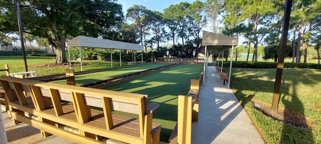 view of property's community with a lawn