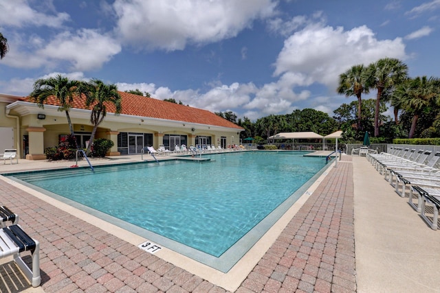 view of swimming pool featuring a patio area