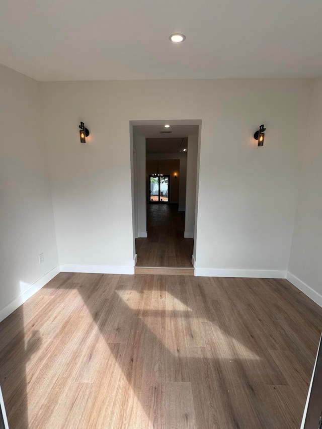 empty room with wood-type flooring