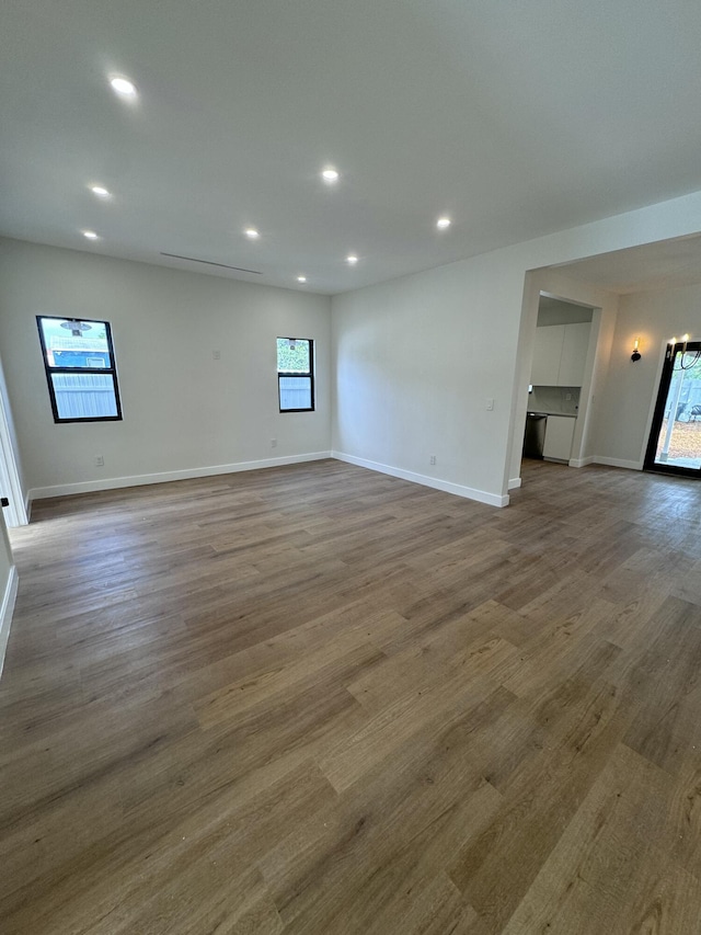 unfurnished living room with hardwood / wood-style floors