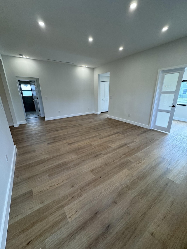 spare room with hardwood / wood-style flooring