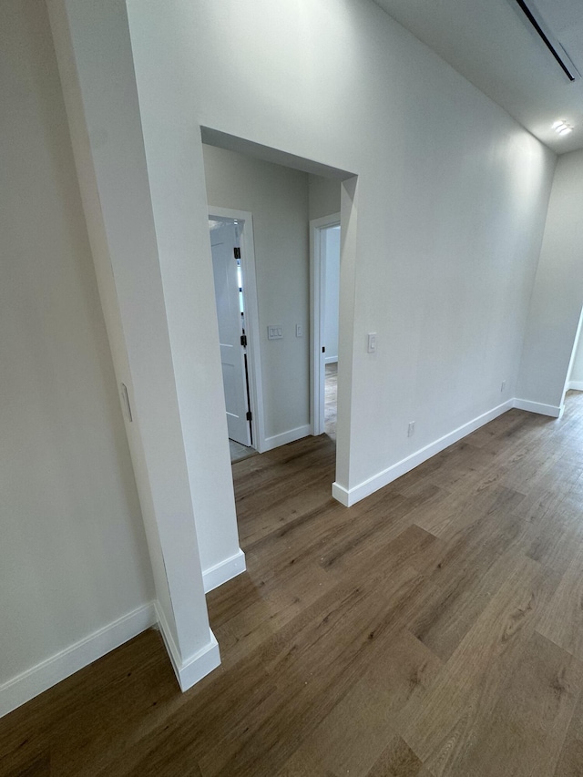 empty room with wood-type flooring