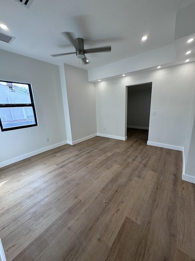 spare room featuring light wood-type flooring and ceiling fan