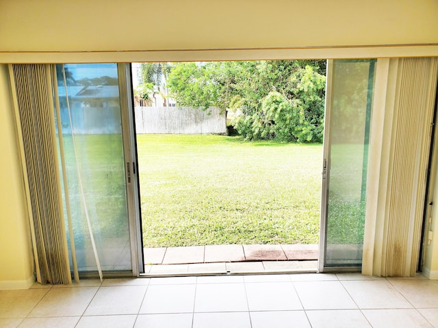 doorway with tile patterned floors