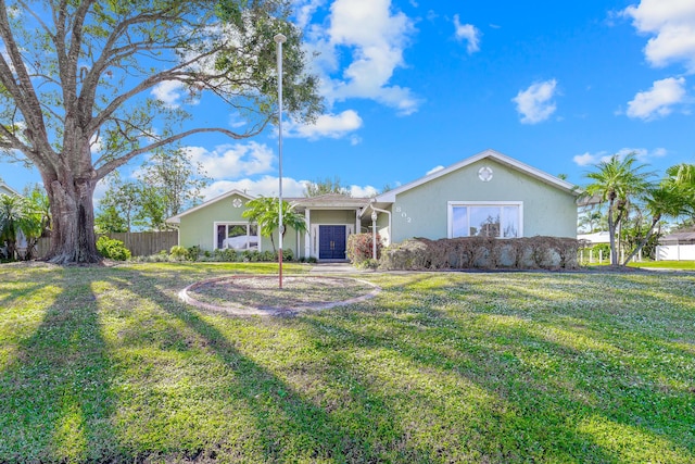 single story home with a front lawn