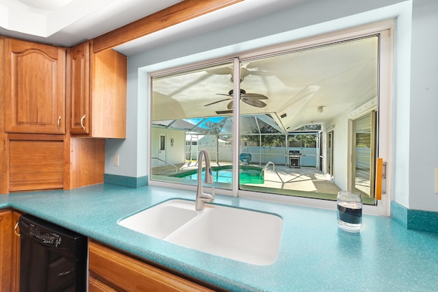 kitchen featuring ceiling fan, sink, vaulted ceiling, and black dishwasher