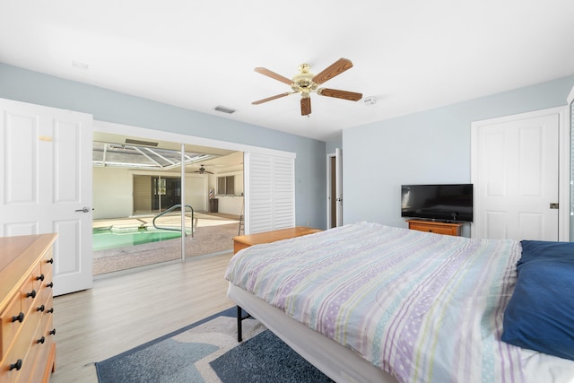 bedroom with ceiling fan and light wood-type flooring