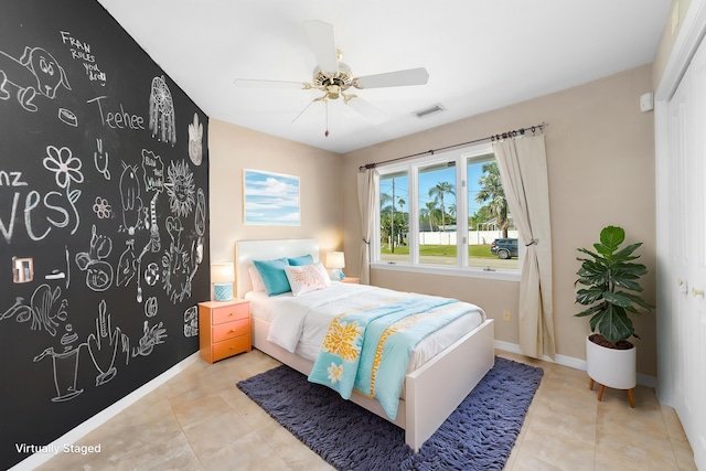 bedroom featuring ceiling fan and light tile patterned flooring