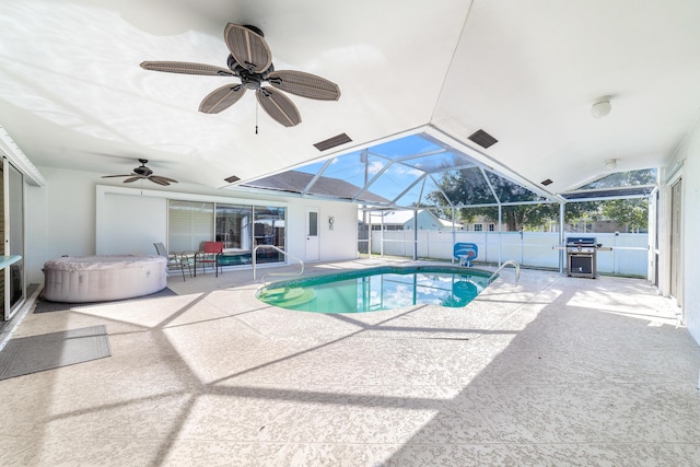 view of pool featuring ceiling fan, a lanai, a grill, a patio area, and a hot tub